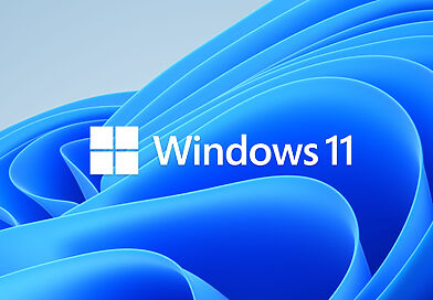 Windows-11-Logo vor dem blauen Bloom-Hintergrund